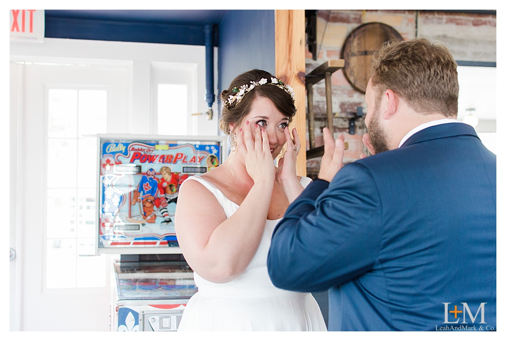 a couple tears up as they see each other on their relaxed wedding day timeline
