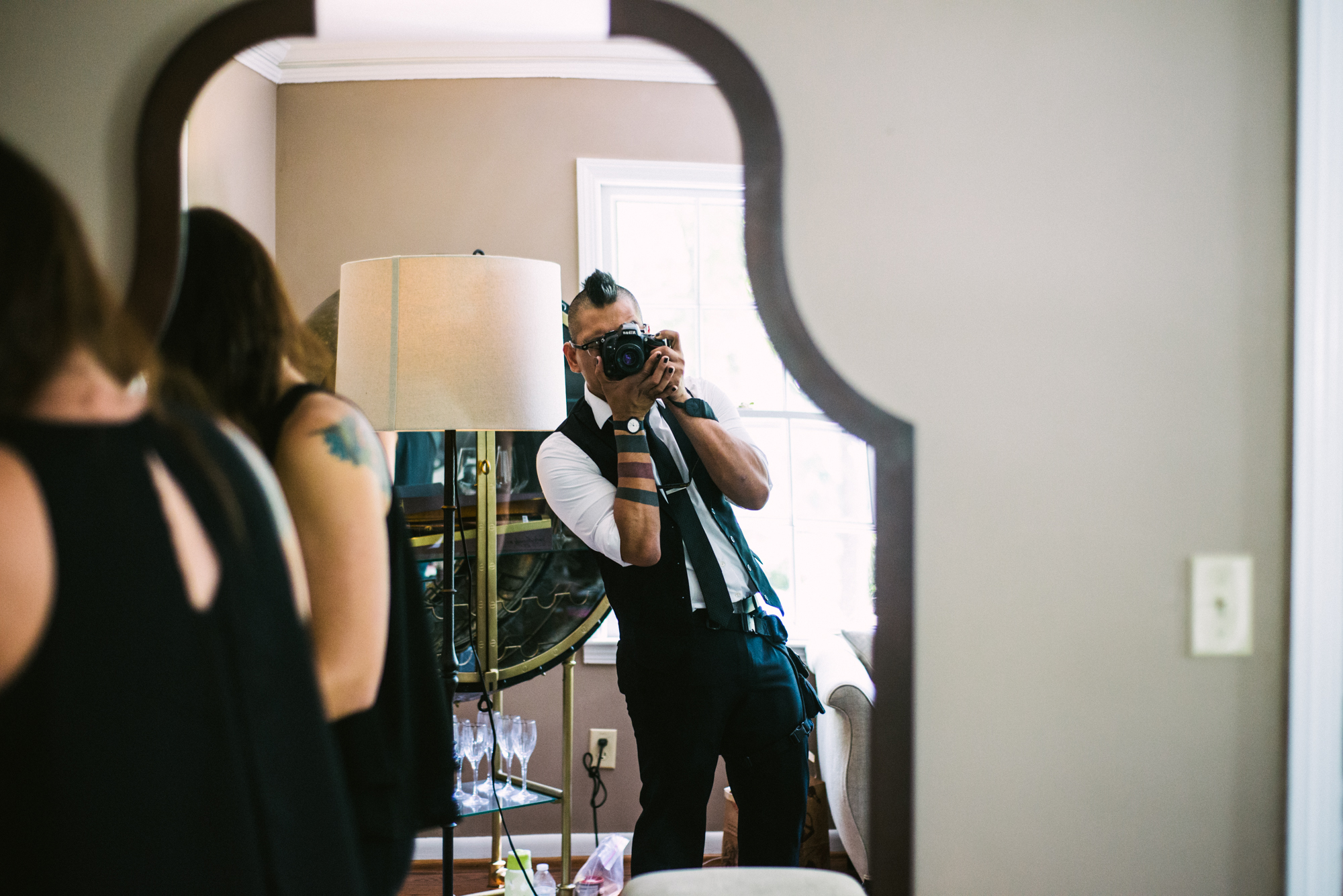 wedding photographer mark tioxon taking a selfie in a mirror